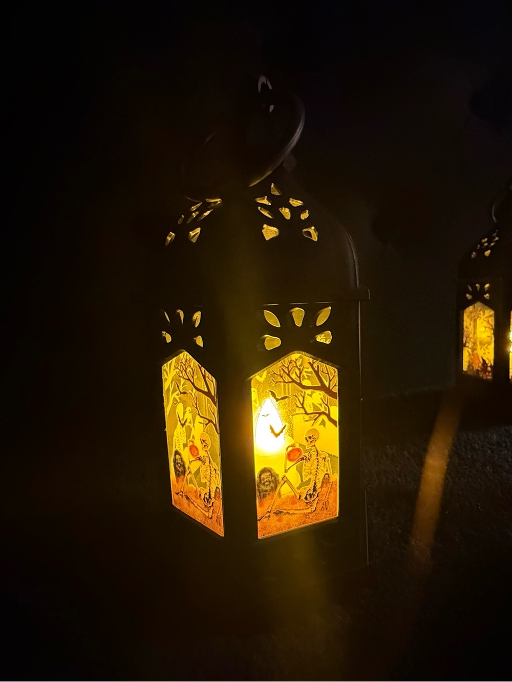 Black Decorative Halloween Lantern with Warm Yellow Illumination
